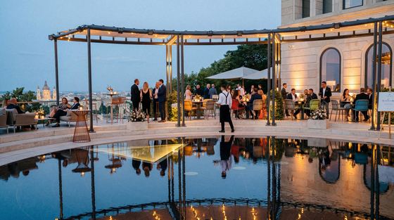 Evening reception on the Aranybástya terrace with its reflecting pool and Danube view