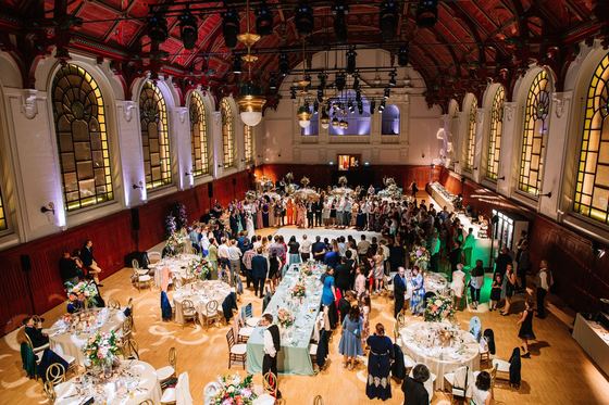 Gala dinner at round tables in the hall of the Royal Riding Hall
